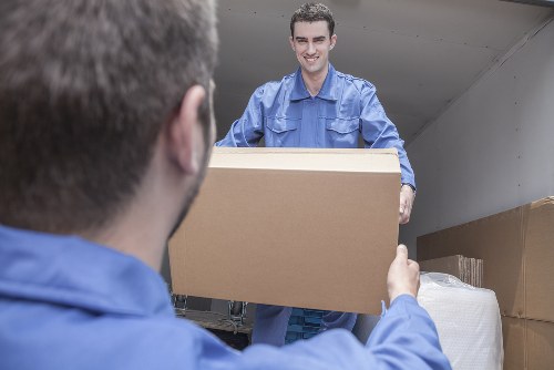 Furniture pick-up team handling bulky items in a Camdentown street