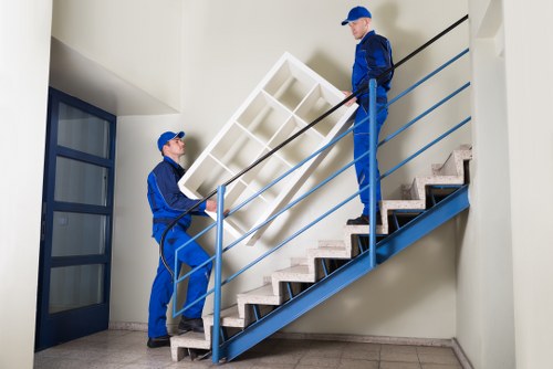Customer and removals crew reviewing service details before transport