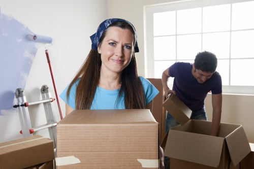 Packed moving boxes and furniture ready for transport in a Camdentown property