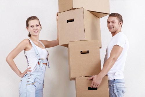 Professional movers carefully transporting household items in Camdentown