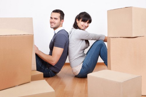 Packed removal van interior with household items secured for transport