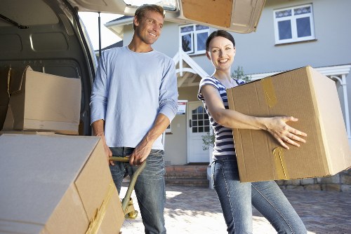 Staff checking public liability insurance documents before relocation